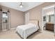 Neutral toned bedroom with adjoining bathroom at 5402 Tidewater Preserve Blvd, Bradenton, FL 34208