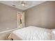 A bedroom features a ceiling fan and neutral colored walls at 5402 Tidewater Preserve Blvd, Bradenton, FL 34208