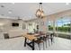 Open concept living offers an attached living space and outdoor views from the dining area at 5402 Tidewater Preserve Blvd, Bradenton, FL 34208