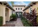 Inviting home entrance featuring a brick pathway and colorful landscaping at 5402 Tidewater Preserve Blvd, Bradenton, FL 34208