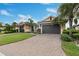 Well maintained house with mature landscaping, brick driveway and a spacious two car garage at 5402 Tidewater Preserve Blvd, Bradenton, FL 34208