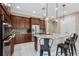 Modern kitchen features custom cabinetry, granite countertops, and a breakfast bar area at 5402 Tidewater Preserve Blvd, Bradenton, FL 34208