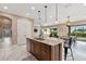 Stylish kitchen features granite countertops, stainless steel appliances, and an open floor plan at 5402 Tidewater Preserve Blvd, Bradenton, FL 34208