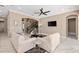Bright living room with tile floors, modern furniture, and an open staircase at 5402 Tidewater Preserve Blvd, Bradenton, FL 34208