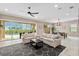 Bright living room boasts neutral tones, an elegant rug, and great view of the lanai at 5402 Tidewater Preserve Blvd, Bradenton, FL 34208