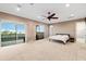 Bright, spacious main bedroom with balcony access and water views at 5402 Tidewater Preserve Blvd, Bradenton, FL 34208
