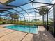 Enclosed pool area with a brick patio and clear blue swimming pool, screened in for privacy and comfort at 5402 Tidewater Preserve Blvd, Bradenton, FL 34208