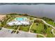 A beautiful community pool overlooks the water in this aerial photograph of the neighborhood at 5402 Tidewater Preserve Blvd, Bradenton, FL 34208
