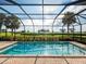 Relaxing screened in pool area with view of the green landscape at 5402 Tidewater Preserve Blvd, Bradenton, FL 34208