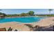 Community pool featuring ample seating and views of the water at 5402 Tidewater Preserve Blvd, Bradenton, FL 34208