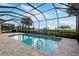 Relaxing screened in pool area with view of the green landscape at 5402 Tidewater Preserve Blvd, Bradenton, FL 34208