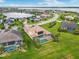 Gorgeous backyard with a screened pool and water view, surrounded by lush greenery at 5402 Tidewater Preserve Blvd, Bradenton, FL 34208