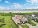 Luxury home boasts a beautiful landscape, expansive tile roof, and stunning water views at 5402 Tidewater Preserve Blvd, Bradenton, FL 34208