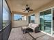 Cozy screened-in patio with stylish furniture and peaceful outdoor vistas at 5402 Tidewater Preserve Blvd, Bradenton, FL 34208
