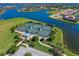 Aerial view of community tennis courts with manicured landscaping and parking nearby at 5402 Tidewater Preserve Blvd, Bradenton, FL 34208