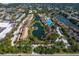 Aerial view showing multiple buildings and landscaping around community lakes at 5736 Ashton Lake Dr, Sarasota, FL 34231