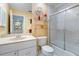 Bathroom with vanity and shower featuring sliding glass doors at 5736 Ashton Lake Dr, Sarasota, FL 34231