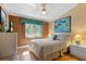 Cozy bedroom with soft lighting, a ceiling fan, and warm color scheme at 5736 Ashton Lake Dr, Sarasota, FL 34231