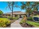 Clubhouse exterior showcasing well-manicured landscaping and outdoor amenities on a sunny day at 5736 Ashton Lake Dr, Sarasota, FL 34231