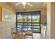 Bright dining area with a glass table and views of the lake at 5736 Ashton Lake Dr, Sarasota, FL 34231