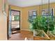 Bright condo entryway with hardwood floors,plant and natural light, creating a welcoming entrance at 5736 Ashton Lake Dr, Sarasota, FL 34231