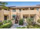 Charming condo exterior boasting well-maintained landscaping, adding to the property's appeal at 5736 Ashton Lake Dr, Sarasota, FL 34231