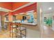 Kitchen bar with barstool seating and granite countertops at 5736 Ashton Lake Dr, Sarasota, FL 34231
