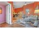 Bright living room with hardwood floors and comfortable furnishings at 5736 Ashton Lake Dr, Sarasota, FL 34231