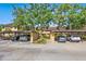 Assigned covered parking area with well-maintained landscaping at 5736 Ashton Lake Dr # 8, Sarasota, FL 34231