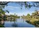 Scenic view of the lake with fountain and waterfront residences at 5736 Ashton Lake Dr, Sarasota, FL 34231