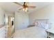 Bright bedroom featuring a bed, closet, dresser, and a view to the hall at 6125 35Th E Ct, Bradenton, FL 34203