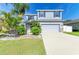Charming two-story home with a well-manicured lawn and vibrant landscaping at 6125 35Th E Ct, Bradenton, FL 34203