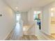 Hallway with staircase, wood flooring, and bedroom views at 6125 35Th E Ct, Bradenton, FL 34203