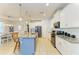 Well-lit kitchen featuring an island with bar seating and stainless steel appliances at 6125 35Th E Ct, Bradenton, FL 34203