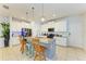 Modern kitchen with granite countertops, stainless steel appliances, and ample cabinet space at 6125 35Th E Ct, Bradenton, FL 34203