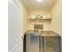 Functional laundry room featuring a modern washer and dryer with decor and storage at 6125 35Th E Ct, Bradenton, FL 34203