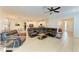Spacious living area with tile floors seamlessly connecting to the dining and kitchen at 6125 35Th E Ct, Bradenton, FL 34203