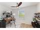 Bright home office with a modern desk, shelving, stylish chair, and a large window for natural light at 6125 35Th E Ct, Bradenton, FL 34203