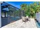 Outdoor patio features a dining table and chairs, as well as a barbeque grill at 6125 35Th E Ct, Bradenton, FL 34203