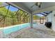 Inviting screened-in pool and patio area with ample space, perfect for entertaining, outdoor dining, and relaxation at 6125 35Th E Ct, Bradenton, FL 34203