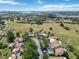 Aerial view of the well-maintained community featuring tree-lined streets, manicured lawns, and nearby waterways at 672 White Pine Tree Rd # 57, Venice, FL 34285