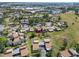 High-angle view of the community with tree lined streets and manicured lawns at 672 White Pine Tree Rd # 57, Venice, FL 34285