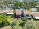 Aerial view showcasing the screened in patio with a beautifully maintained lawn at 672 White Pine Tree Rd # 57, Venice, FL 34285