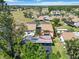 An aerial view showcasing a two-story condo surrounded by lush greenery at 672 White Pine Tree Rd # 57, Venice, FL 34285