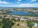 Panoramic aerial view of a residential community with waterways, and nearby ocean views at 672 White Pine Tree Rd # 57, Venice, FL 34285