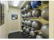 Organized storage of exercise balls on racks, offering a convenient and space-saving solution in the fitness area at 672 White Pine Tree Rd # 57, Venice, FL 34285