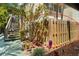A view of the wooden fence providing privacy and security around the property at 672 White Pine Tree Rd # 57, Venice, FL 34285