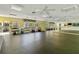 Community gym with mirrored wall, exercise equipment, and plenty of space for exercise and other fitness activities at 672 White Pine Tree Rd # 57, Venice, FL 34285