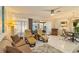 Bright living room featuring comfortable seating, modern decor, and access to the lanai at 672 White Pine Tree Rd # 57, Venice, FL 34285