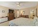 Serene main bedroom featuring neutral tones, spacious layout, and access to an en-suite bathroom at 672 White Pine Tree Rd # 57, Venice, FL 34285